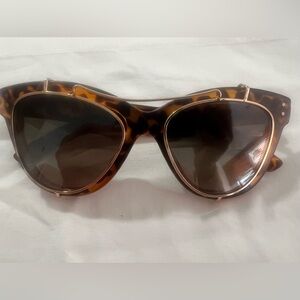 Tortoise shell sunglasses with gold lenses